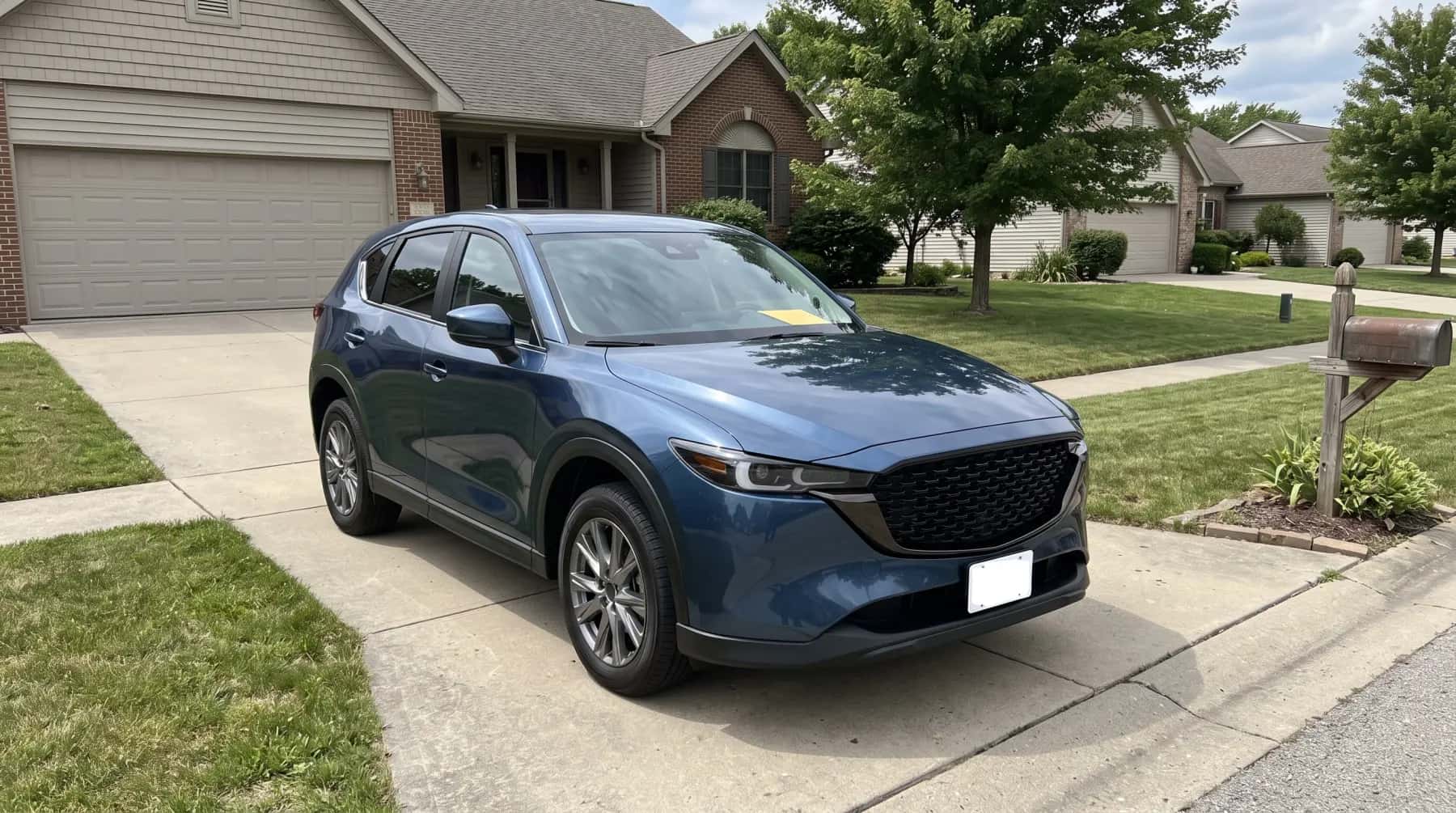 Blue SUV parked in a driveway