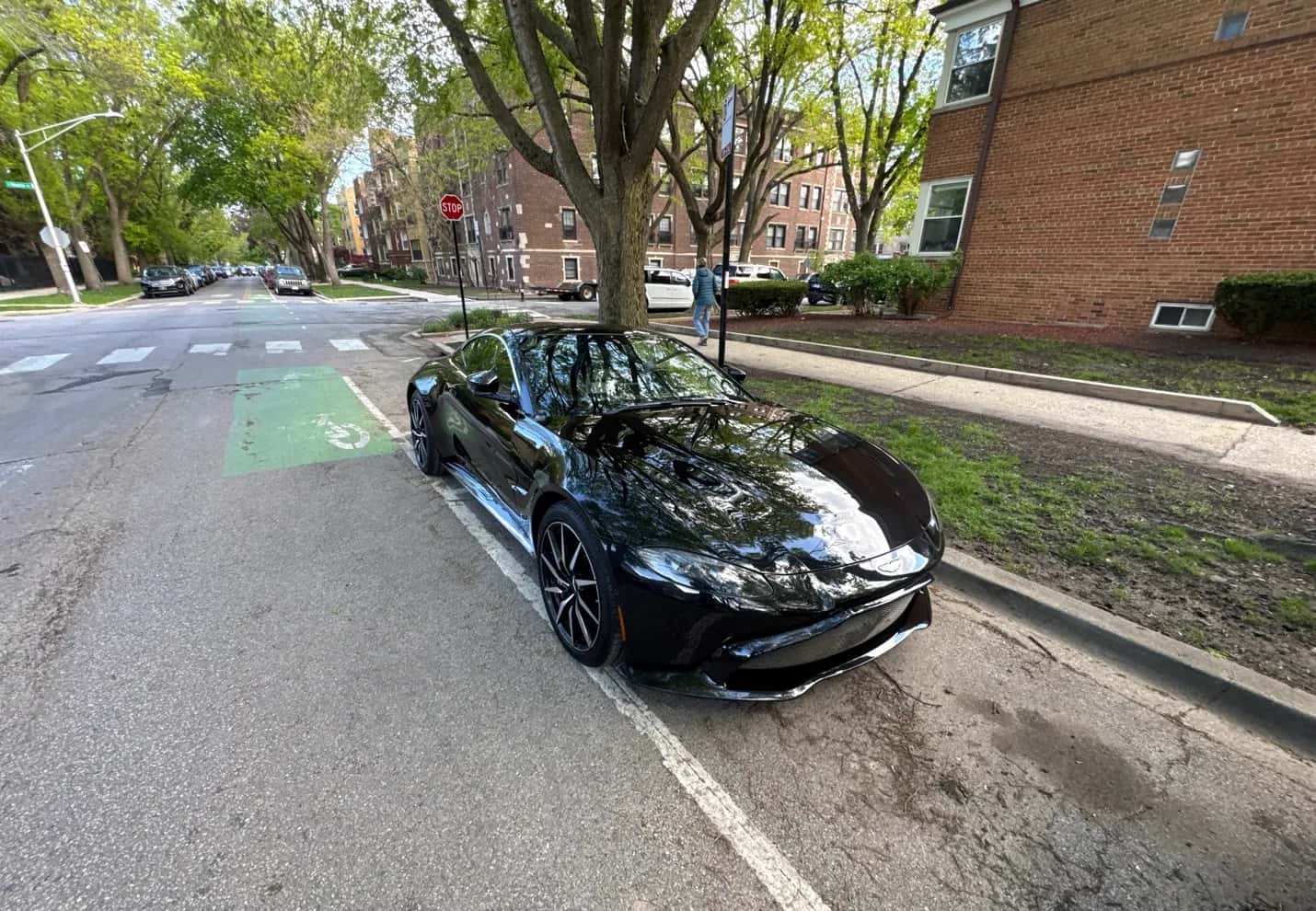 Black Aston Martin Vantage parked on a city street